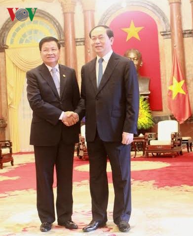 Президент СРВ Чан Дай Куанг принял премьера Лаоса Тхонглуна Сисулита - ảnh 1
